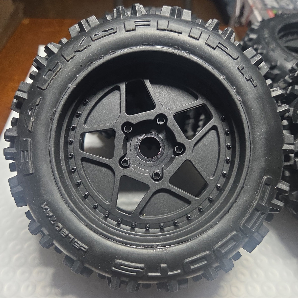 ARRMA Outcast 4S dBoots Backflip LP wheel and tire closeup new takeoff