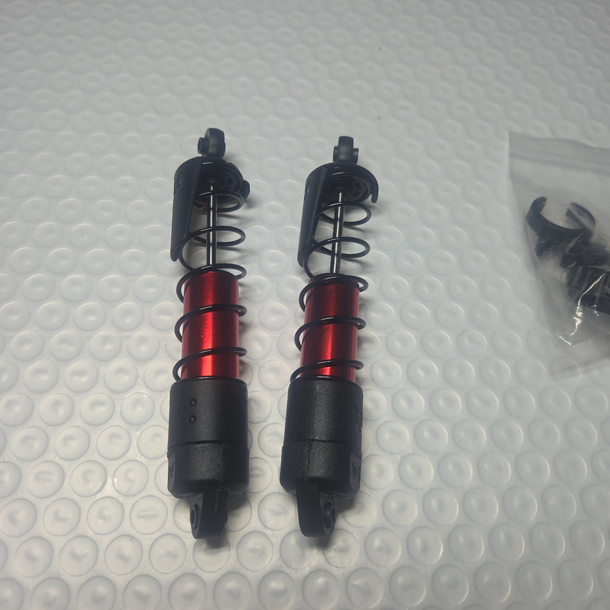 ARRMA Outcast 4S red aluminum shock pair new takeoff alternate view